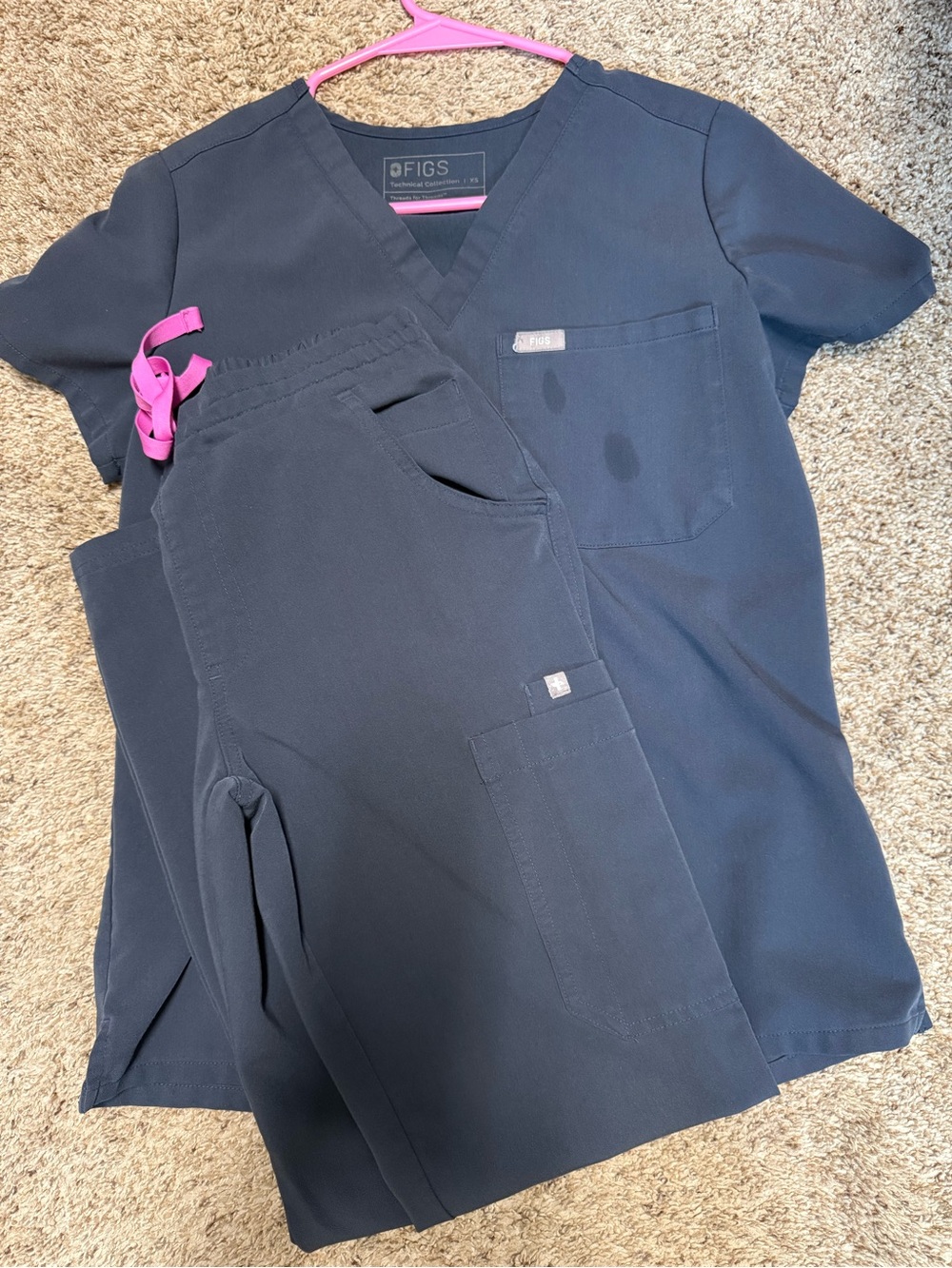 FIGS Dark Harbor Catarina scrub top and Yola skinny bottoms.